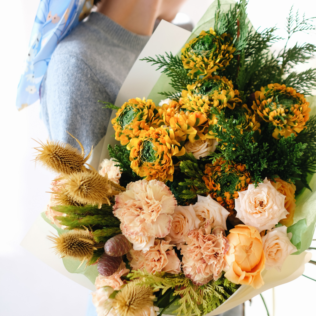Expert florist crafting stunning arrangements at Palette De Flores