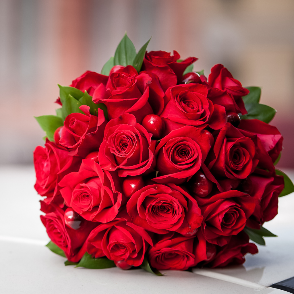 Red rose bridal bouquet with lush greenery, perfect for weddings in Sydney