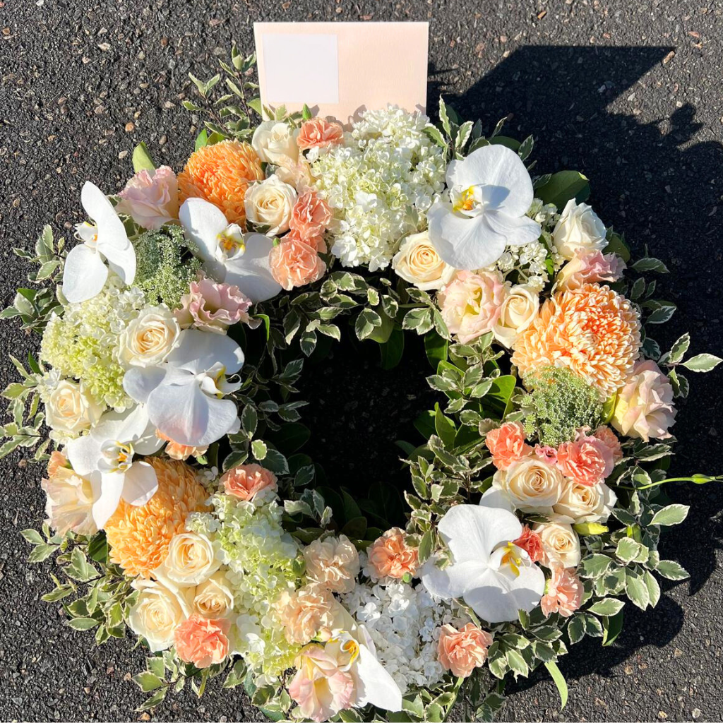 Sympathy floral wreath elegantly arranged with vibrant blooms, symbolising love and remembrance